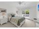 Comfortable bedroom with balcony access, carpeted floors, and a ceiling fan at 2624 Jenkins Point Rd, Seabrook Island, SC 29455