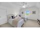 Charming bedroom with two twin beds, nautical decor, and a ceiling fan at 2624 Jenkins Point Rd, Seabrook Island, SC 29455
