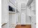 Custom walk-in closet with built-in shelving and ample storage space at 2624 Jenkins Point Rd, Seabrook Island, SC 29455