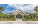 Beautiful community clubhouse with a covered entryway, lush landscaping, and a welcoming entrance at 2624 Jenkins Point Rd, Seabrook Island, SC 29455