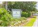 Community entrance sign with lush landscaping and vibrant flowerbeds for Freshfields Village at 2624 Jenkins Point Rd, Seabrook Island, SC 29455