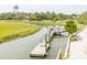 Picturesque dock on the marsh with water tower and lush vegetation at 2624 Jenkins Point Rd, Seabrook Island, SC 29455