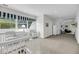 Spacious hallway featuring natural light, staircase and access to the adjacent rooms at 2624 Jenkins Point Rd, Seabrook Island, SC 29455