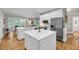 Spacious kitchen with double islands, stainless steel appliances, and hardwood floors at 2624 Jenkins Point Rd, Seabrook Island, SC 29455