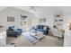 Comfortable living room with vaulted ceilings, neutral carpet and cozy, bright decor at 2624 Jenkins Point Rd, Seabrook Island, SC 29455