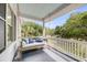 Cozy porch swing with comfortable cushions, perfect for enjoying the serene outdoor views at 2624 Jenkins Point Rd, Seabrook Island, SC 29455