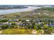 Beautiful aerial view showcasing waterfront homes adjacent to marshland and waterways at 3101 S Shore Dr, Charleston, SC 29407