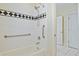Bathroom boasts a white tiled shower with black accent and safety bars at 3101 S Shore Dr, Charleston, SC 29407