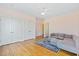 Bedroom showcasing a comfortable gray couch and hardwood floors at 3101 S Shore Dr, Charleston, SC 29407