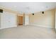 Bright room showcases carpet, fan, recessed lights, windows and access to additional spaces at 3101 S Shore Dr, Charleston, SC 29407