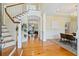 Welcoming foyer with wood floors and staircase leading to the upper level at 3101 S Shore Dr, Charleston, SC 29407