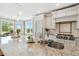 Granite counters, stainless appliances, and a view of the dining area define this stylish kitchen at 3101 S Shore Dr, Charleston, SC 29407