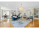 Bright living room boasts an open floor plan and stylish decor, flowing into dining and kitchen areas at 3101 S Shore Dr, Charleston, SC 29407