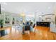 Bright living room with hardwood floors and open floor plan provides views from multiple windows and doors at 3101 S Shore Dr, Charleston, SC 29407