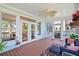 Inviting screened porch with wood floors, comfy seating, and scenic views of the landscape at 3101 S Shore Dr, Charleston, SC 29407