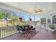 Cozy screened porch features comfortable seating and picturesque marsh views at 3101 S Shore Dr, Charleston, SC 29407