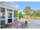 Beautiful screened porch with scenic views, outdoor seating and railing at 3101 S Shore Dr, Charleston, SC 29407