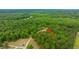 Aerial view of the wooded property with arrow showing location at 312 Piney Grove Rd, Cross, SC 29436