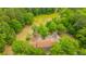 Overhead view of a charming home with verdant surroundings, driveway and yard at 312 Piney Grove Rd, Cross, SC 29436