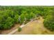 Aerial view of the property with a long driveway and mature trees at 312 Piney Grove Rd, Cross, SC 29436