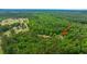 Expansive aerial view of wooded property and home nestled amidst lush trees at 312 Piney Grove Rd, Cross, SC 29436