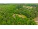 Scenic aerial view of a home with a sprawling wooded lot at 312 Piney Grove Rd, Cross, SC 29436