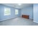 Bedroom with carpet, two windows and a wooden cabinet at 312 Piney Grove Rd, Cross, SC 29436
