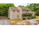 Charming two-story home featuring a covered front porch and lush surroundings at 312 Piney Grove Rd, Cross, SC 29436