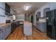 Spacious kitchen with stainless steel appliances, wood countertops, and gray cabinetry at 312 Piney Grove Rd, Cross, SC 29436