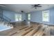 Bright living room with new floors, double doors, and stairs at 312 Piney Grove Rd, Cross, SC 29436
