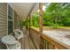 Relax on the porch with the outdoor seating and green view at 312 Piney Grove Rd, Cross, SC 29436