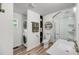 This bathroom combines the convenience of a laundry setup with a clean sink and enclosed glass shower at 3293 River Rd, Johns Island, SC 29455
