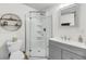 A crisp, clean bathroom featuring a glass-enclosed shower and vanity sink at 3293 River Rd, Johns Island, SC 29455
