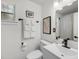 Neat bathroom with updated fixtures, a decorative mirror, and fresh white towels at 3293 River Rd, Johns Island, SC 29455