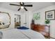 Tranquil bedroom with hardwood floors, ceiling fan, and plenty of natural light at 3293 River Rd, Johns Island, SC 29455