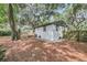 The home's exterior features a wood deck, providing an ideal spot for outdoor entertaining, with privacy fence at 3293 River Rd, Johns Island, SC 29455