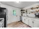 Bright kitchen featuring white cabinetry, stainless steel appliances, and hardwood flooring at 3293 River Rd, Johns Island, SC 29455