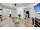 Bright living room with hardwood floors, a ceiling fan, and modern decor and appliances at 3293 River Rd, Johns Island, SC 29455