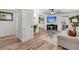 Bright living room features hardwood floors, a ceiling fan, and modern decor at 3293 River Rd, Johns Island, SC 29455