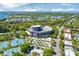 Aerial view showcasing the Credit One Stadium, tennis courts, surrounding neighborhoods, and waterfront in Charleston at 332 Bayley Rd, Daniel Island, SC 29492
