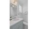 Bright bathroom featuring a marble countertop, stylish mirror, and white subway tile at 332 Bayley Rd, Daniel Island, SC 29492