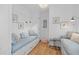 Bright, small bedroom with built-in daybeds, charming decor, and hardwood floors at 332 Bayley Rd, Daniel Island, SC 29492