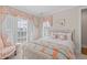 Charming bedroom with beautiful window treatments, comfortable bed, and decorative accents at 332 Bayley Rd, Daniel Island, SC 29492