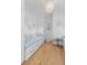 Bright, small bedroom with built-in daybeds, charming decor, and hardwood floors at 332 Bayley Rd, Daniel Island, SC 29492