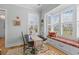 Charming breakfast nook with a bay window, window seat, and comfortable seating for casual dining at 332 Bayley Rd, Daniel Island, SC 29492
