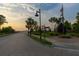 Charming community entrance with brick paved road and lush landscaping at 332 Bayley Rd, Daniel Island, SC 29492