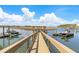 Dock featuring a gazebo with seating and boat lifts, as well as beautiful views of the water and surrounding marsh at 332 Bayley Rd, Daniel Island, SC 29492