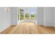 Bright, airy room featuring gleaming hardwood floors, a bay window, and neutral walls at 332 Bayley Rd, Daniel Island, SC 29492
