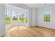 Bright room with hardwood floors, large windows, and ample natural light for a welcoming space at 332 Bayley Rd, Daniel Island, SC 29492