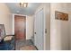 Inviting entryway with decor, hooks, and multiple doors leading to different areas of the home at 332 Bayley Rd, Daniel Island, SC 29492